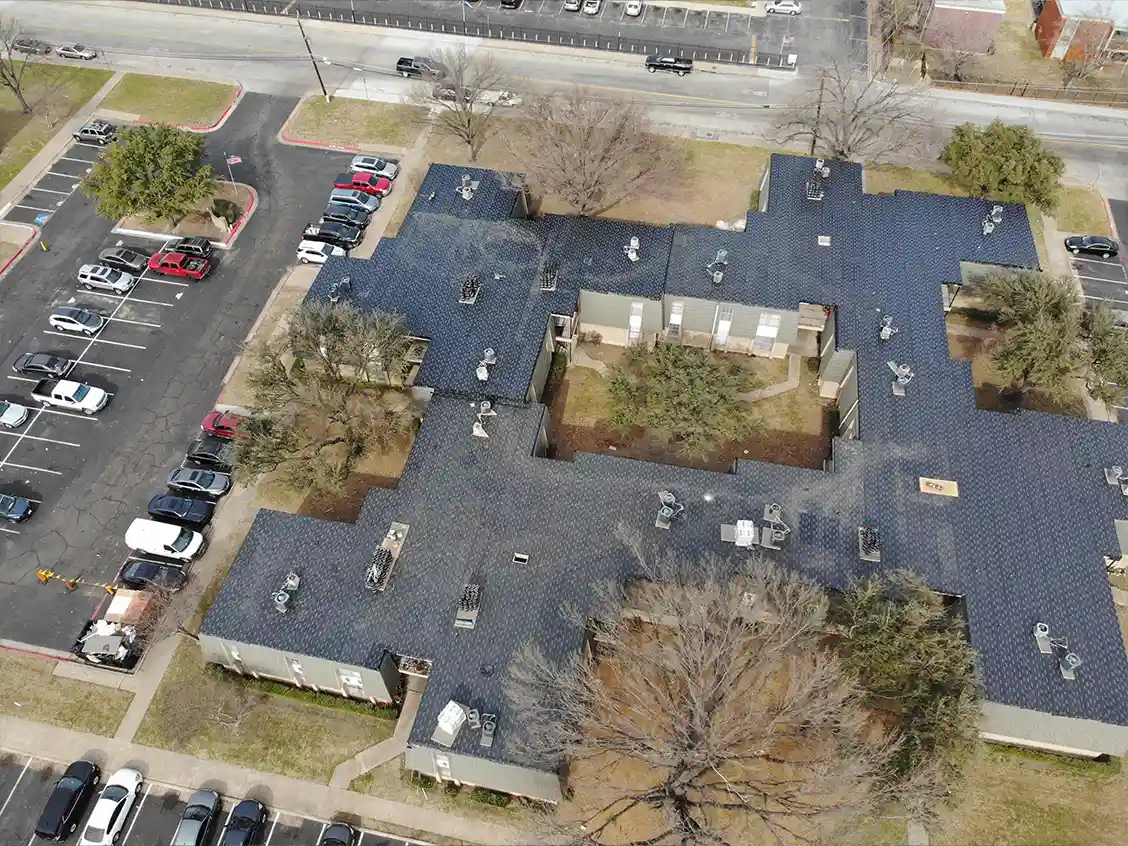 Commercial Roofing Building WIth Roofing Services being done